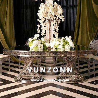 ভালো দাম বিবাহ এবং হোটেলের জন্য মিরর গ্লাস টপ গোল্ড সেন্টারপিস সহ নেস্ট বেস ডাবল পেডেস্টাল ডাইনিং টেবিল অনলাইন