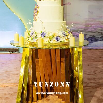 ভালো দাম হোটেল আসবাবপত্রের জন্য গোল্ড নেস্ট বেস স্টেইনলেস স্টিল সহ হোয়াইট গ্লাস ওয়েডিং ডিসপ্লে কেক টেবিল অনলাইন
