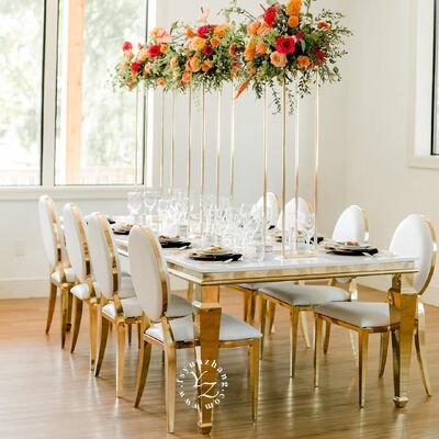 ভালো দাম আধুনিক গোল্ড স্টেইনলেস স্টীল আয়নাযুক্ত গ্লাসের উপরে হোটেলের জন্য ডাইনিং টেবিল বিবাহের পার্টি উদযাপনের জন্য আউটডোর ইভেন্ট অনলাইন